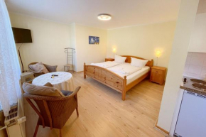 Bungalow Bergstrasse 3 Ferienwohnung 1, Loddin